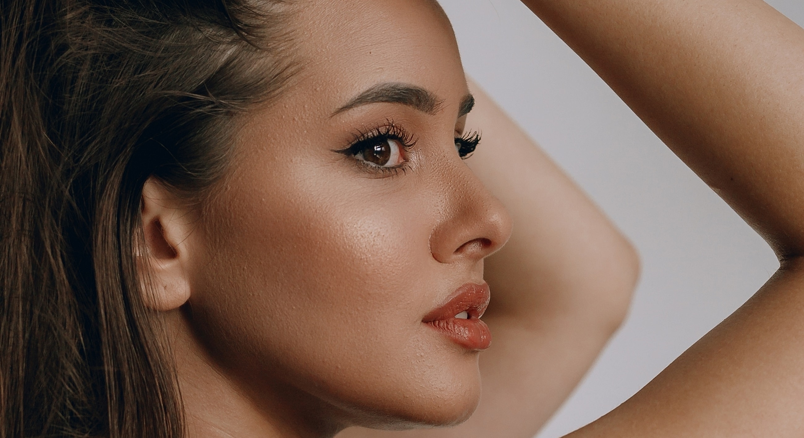Profile of a woman with elegant makeup.