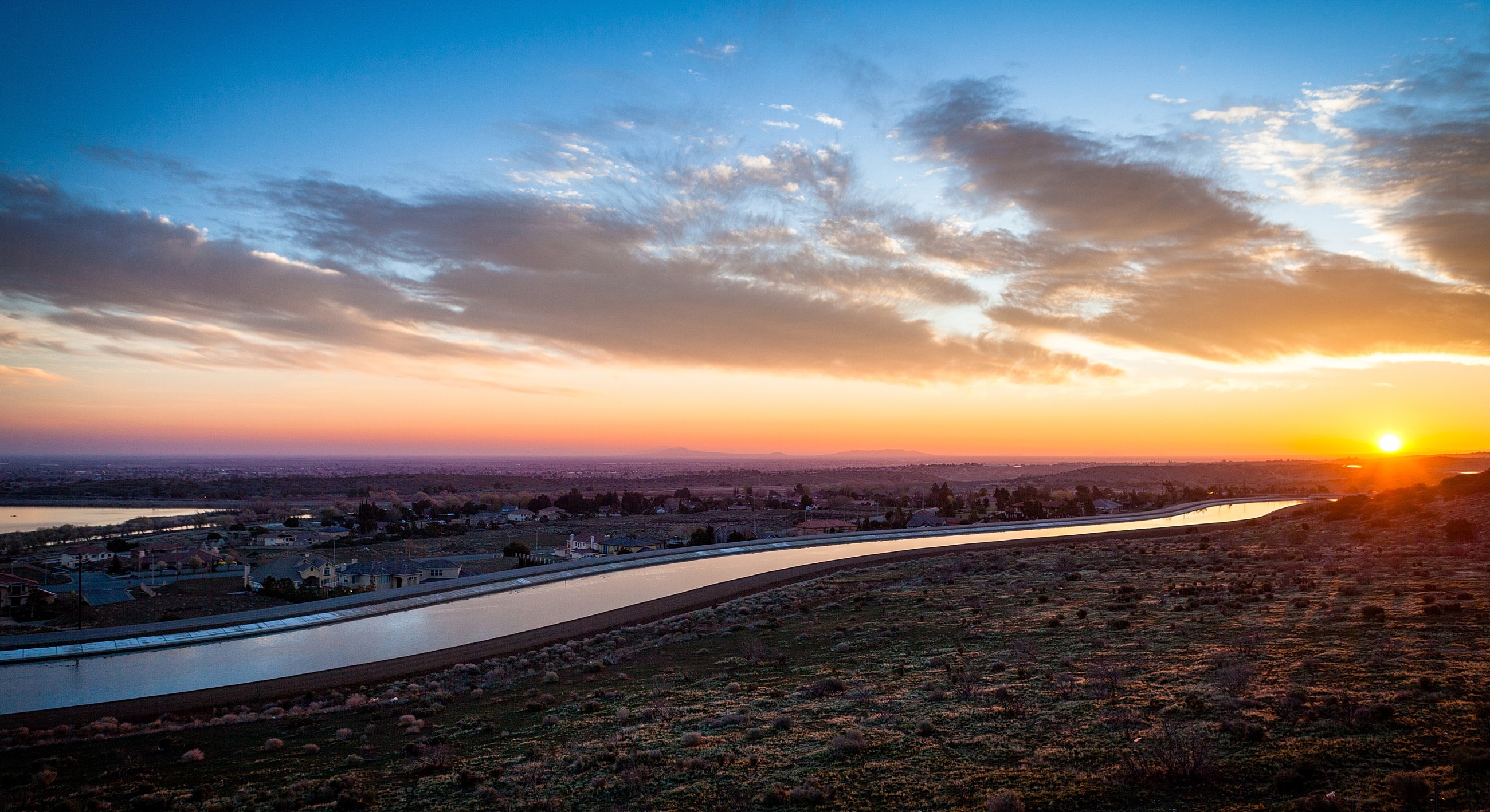 Beautiful sunset over landscape and waterway.